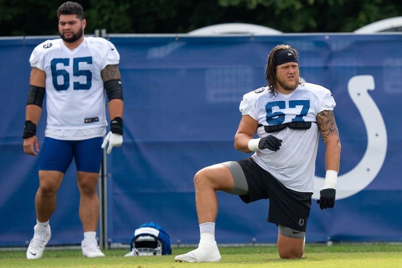 Indianapolis Colts offensive tackle Luke Tenuta (67) warms up Friday, July 25, 2025, ahead of training camp held at Grand Park in Westfield.
