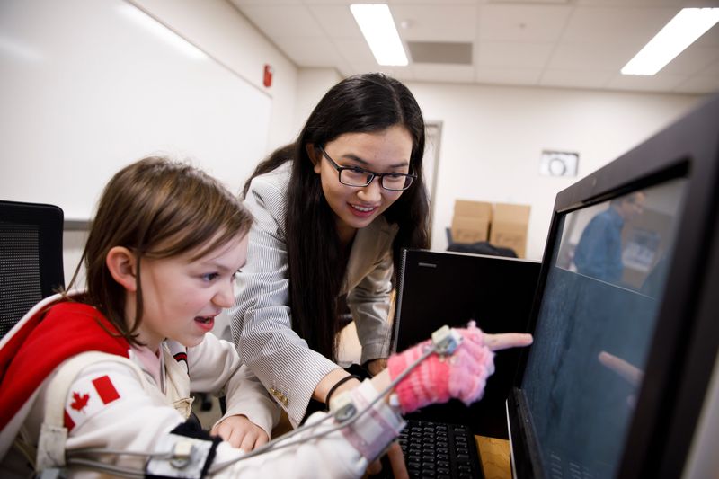 IU graduate student Di Wu observes a patient perform the screening test in Swain Hall on Friday, Dec. 22, 2017.