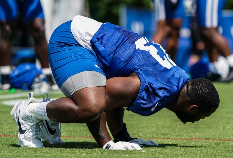 Indianapolis Colts player Tim Smith (93) stretches during training Camp at Grand Park on Saturday, July 26, 2025, in Westfield, Ind.
