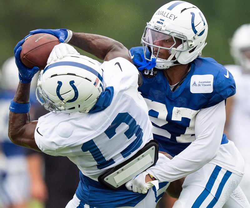 Indianapolis Colts cornerback Justin Walley (27) defends Indianapolis Colts wide receiver Laquon Treadwell (13) on Monday, July 28, 2025, during training camp held at Grand Park in Westfield.