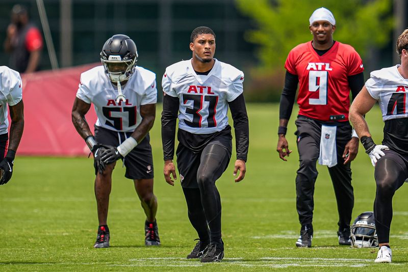 Jun 11, 2025; Atlanta, GA, USA; Atlanta Falcons safety Xavier Watts (31) warms up during Minicamp at Children's Healthcare of Atlanta Training Ground. Mandatory Credit: Dale Zanine-Imagn Images