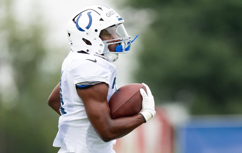 Indianapolis Colts running back DJ Giddens (21) runs Monday, July 28, 2025, during training camp held at Grand Park in Westfield.
