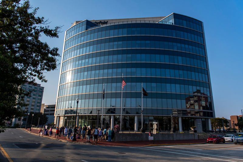 People gather out CenterPoint Energy Plaza to express fustration over high utlity bills in July in Downtown Evansville, Ind., Friday, Aug. 1, 2025.