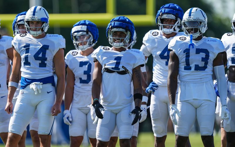 Indianapolis Colts wide receiver Alec Pierce (14), Indianapolis Colts wide receiver Josh Downs (1), and Indianapolis Colts wide receiver Laquon Treadwell (13) sits to run drills on Sunday, Aug. 3, 2025, during Indianapolis Colts Training Camp at Grand Park in Westfield.