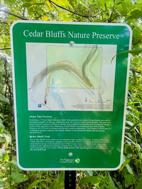A sign with a map is located near the beginning of the trail at Cedar Bluffs Nature Preserve.