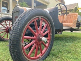 This 1917 Ford Model T racer has stock tires and wooden-spoke wheels.