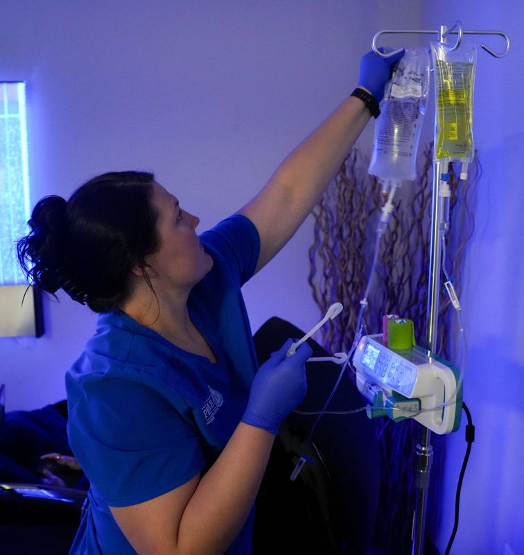 Nurse Liz Patrick checks an IV bag on Tuesday, Aug. 5, 2025, at Prime IV Hydration & Wellness in Greenwood.