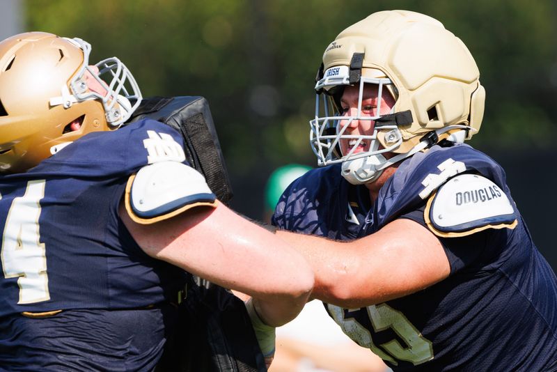 Notre Dame offensive lineman Will Black, right, practices blocking during a football practice at Irish Athletic Center on Wednesday, Aug. 6, 2025, in South Bend.