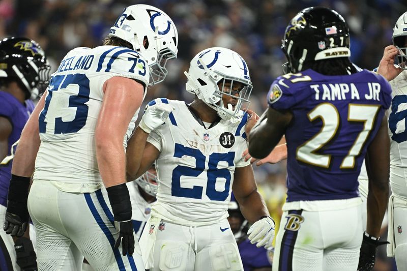 Aug 7, 2025; Baltimore, Maryland, USA; Indianapolis Colts running back Khalil Herbert (26) celebrates with offensive tackle Blake Freeland (73) after scoring a touchdown against the Baltimore Ravens during the third quarter at M&T Bank Stadium. Mandatory Credit: Rafael Suanes-Imagn Images