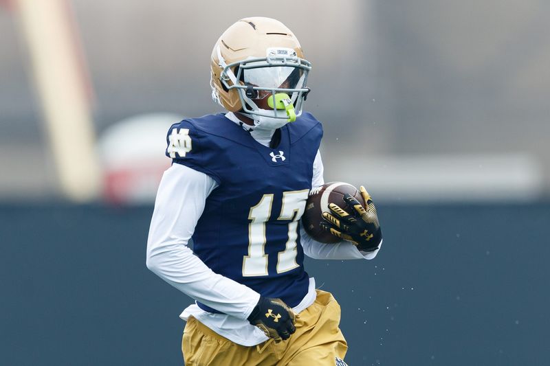 Notre Dame wide receiver Elijah Burress runs with the ball during a football practice at Irish Athletic Center on Thursday, July 31, 2025, in South Bend.