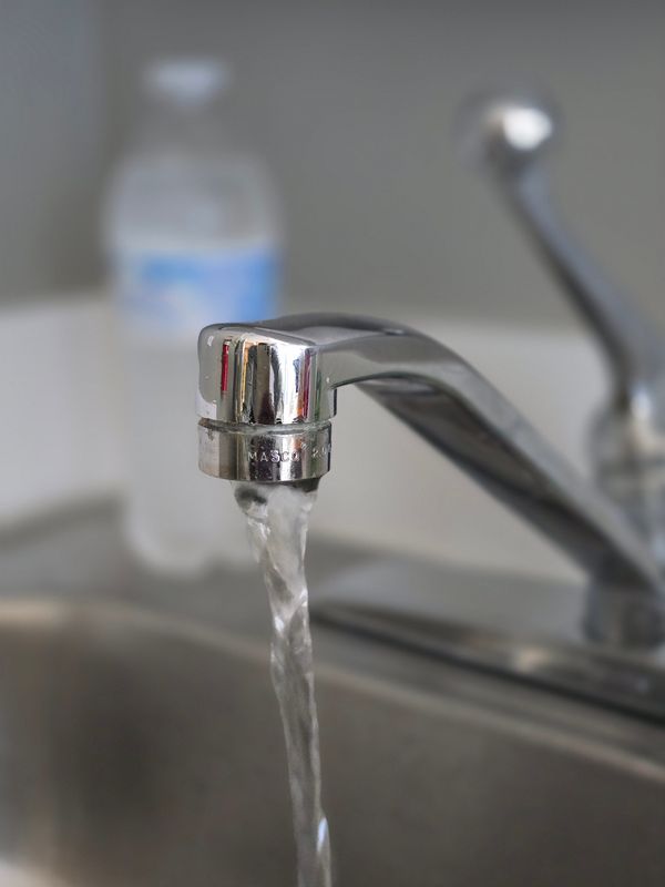 Water flowing from a kitchen sink tap. The federal government under President Donald Trump has paused new regulations governing PFAS, so-called â€˜forever chemicals,â€™ and has also frozen funding for a number of environmental projects. Fayetteville and Cumberland County are among places that have been impacted.