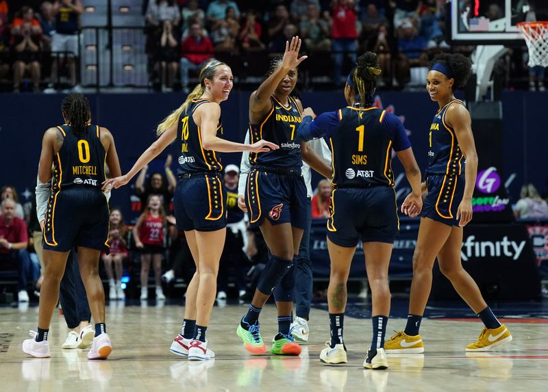 Aug 17, 2025; Uncasville, Connecticut, USA; The Indiana Fever react during a time against the Connecticut Sun in overtime at Mohegan Sun Arena. Mandatory Credit: David Butler II-Imagn Images