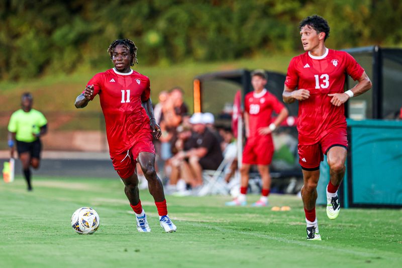 Indiana forward Collins Oduro, left, and defender Alex Barger work up the left side against Western Michigan on Aug. 11, 2025, at Bill Armstrong Stadium in Bloomington.
