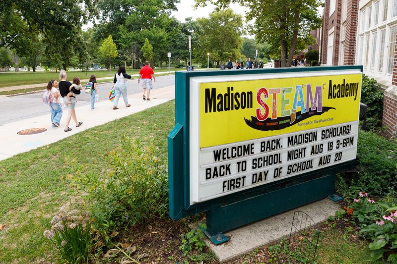Parents walk their kids to school before the first day of the 2025-26 school year at Madison STEAM Academy on Wednesday, Aug. 20, 2025, in South Bend.