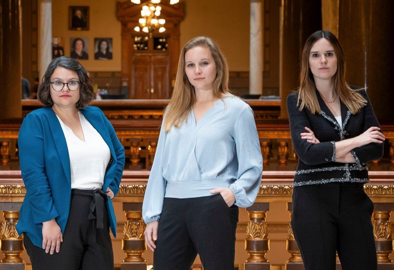 IndyStar senior government accountability reporter Hayleigh Colombo, statehouse reporter Kayla Dwyer and politics editor Kaitlin Lange pose Monday, Nov. 25, 2024, inside the statehouse in Indianapolis.