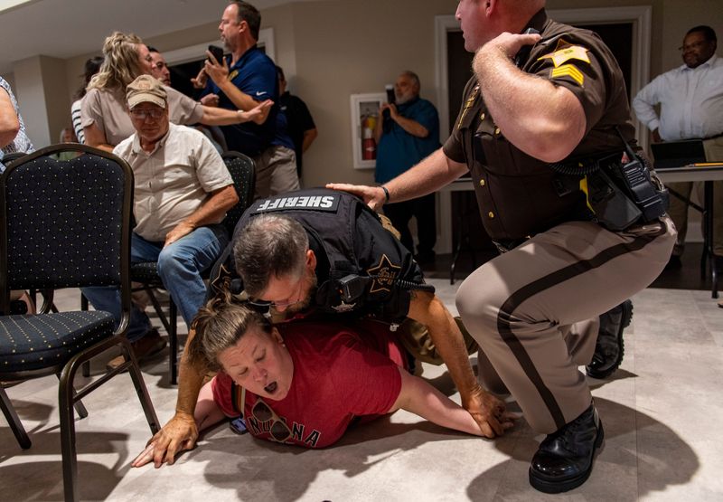 Amanda Bennett is arrested by the Warrick County Sheriff's Office during a town hall hosted by Indiana Lt. Gov. Micah Beckwith in Newburgh on Wednesday, Aug. 20, 2025.