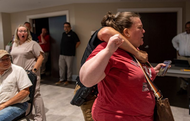 Amanda Bennett is arrested by the Warrick County Sheriff's Office during a town hall hosted by Indiana Lt. Gov. Micah Beckwith in Newburgh on Wednesday, Aug. 20, 2025.