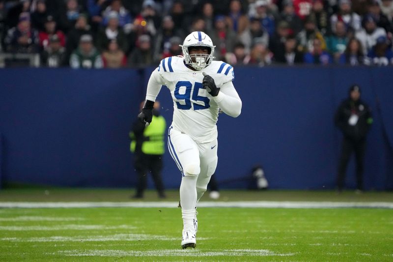 Nov 12, 2023; Frankfurt, Germany; Indianapolis Colts defensive end Adetomiwa Adebawore (95) in the first half during an NFL International Series game against the New England Patriots at Deutsche Bank Park. Mandatory Credit: Kirby Lee-USA TODAY Sports