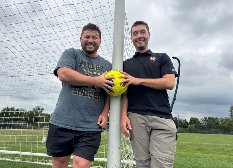 Noblesville soccer coaches Mitch Holden (girls) and Thomas Doering (boys) pose at Noblesville High School on Thursday, Aug. 21, 2025. Both are in their first year as head coaches at the school.