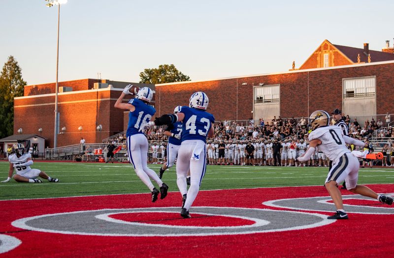 Memorial's Wes Kelley (16) intercepts a pass in the end zone as the Memorial Tigers play the Jasper Wildcats at Enlow Field in Evansville, Ind., Friday, Aug. 22, 2025.