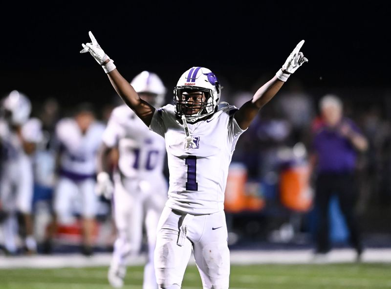 Muncie Central sophomore Carlos Echols Jr. lifts his arms in celebration during the Bearcats' 16-13 win over Delta on Friday, Aug. 22, 2025.