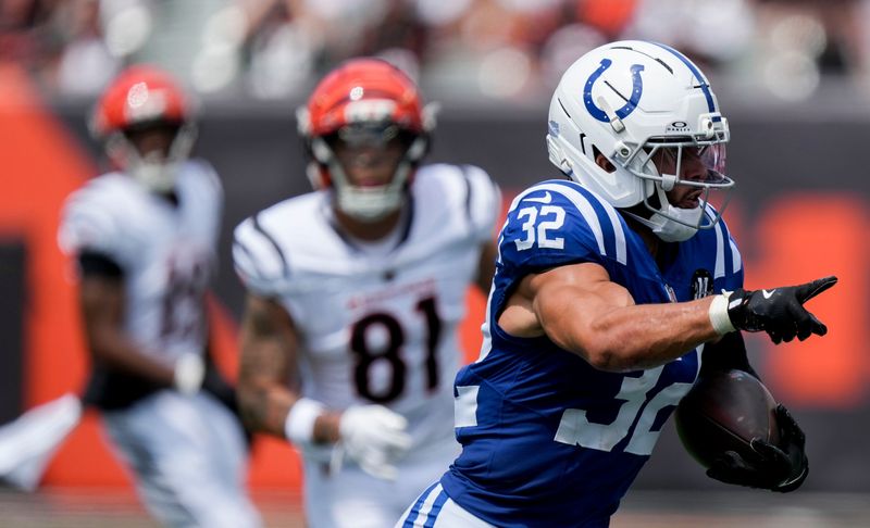 Indianapolis Colts safety Daniel Scott (32) intercepts a pass ball and runs in for a touchdown Saturday, Aug. 23, 2025, during a game against the Cincinnati Bengals at Paycor Stadium in Cincinnati.