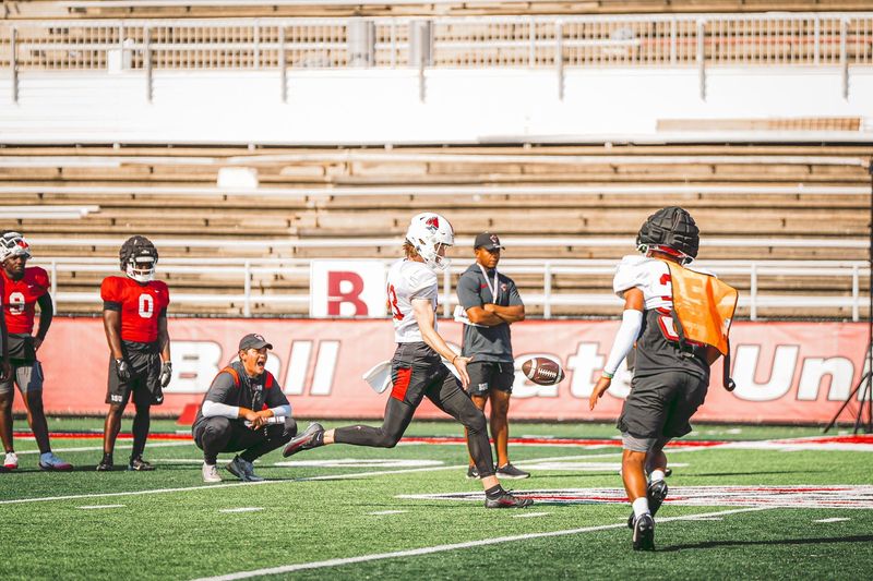 Ball State football punter Adam Saul kicks one away during Cardinals training camp.
