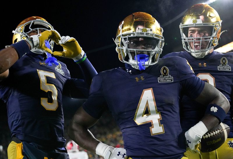 Notre Dame RB Jeremiyah Love (4) celebrates after scoring a touchdown during the first half of a game between the Indiana Hoosiers and the Notre Dame Fighting Irish in first round of the College Football Playoff on Friday, Dec. 20, 2024, in South Bend.