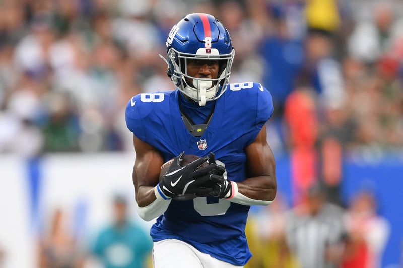 Aug 16, 2025; East Rutherford, New Jersey, USA; New York Giants wide receiver Beaux Collins (8) runs with the ball after a catch against the New York Jets during the first half at MetLife Stadium. Mandatory Credit: Rich Barnes-Imagn Images