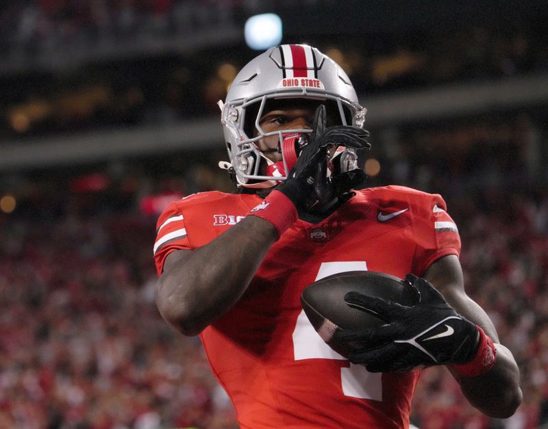 Sept. 7, 2024; Columbus, Ohio, USA;
Ohio State Buckeyes wide receiver Jeremiah Smith (4) celebrates after scoring a touchdown during the first half of an NCAA Division I football game on Saturday at Ohio Stadium.