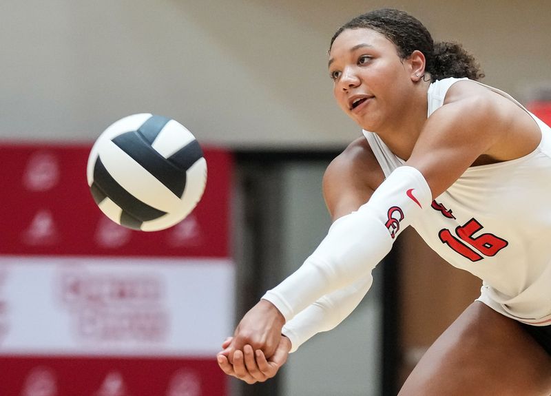 Center Grove Trojans outside hitter Gabby Gilliard (16) hits the ball Thursday, Aug. 28, 2025, during a game at Center Grove High School in Greenwood.