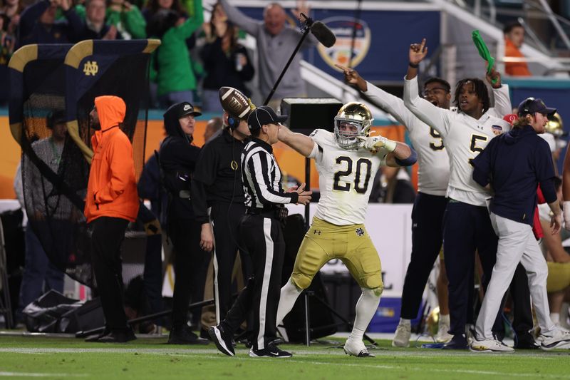 Jan 9, 2025; Miami, FL, USA; Notre Dame Fighting Irish running back Aneyas Williams (20) celebrates a first down in the second half against the Penn State Nittany Lions in the Orange Bowl at Hard Rock Stadium. Mandatory Credit: Nathan Ray Seebeck-Imagn Images