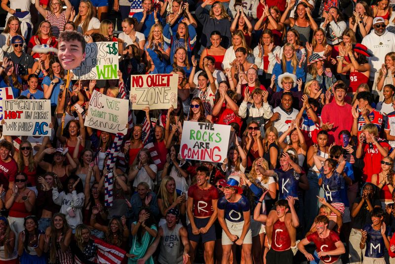 The Westfield Shamrocks student section cheers Friday, Aug. 29, 2025, during a high school football game between the Carmel Greyhounds and the Westfield Shamrocks at Carmel High School.