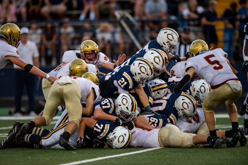 The Castle Knights push for a yard as the Castle Knights play the Mater Dei Wildcats in Newburgh, Ind., Friday, Aug. 29, 2025.