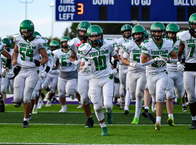 Yorktown takes the field before an IHSAA high school football game Friday, Aug. 29, 2025, at Muncie Central High School.