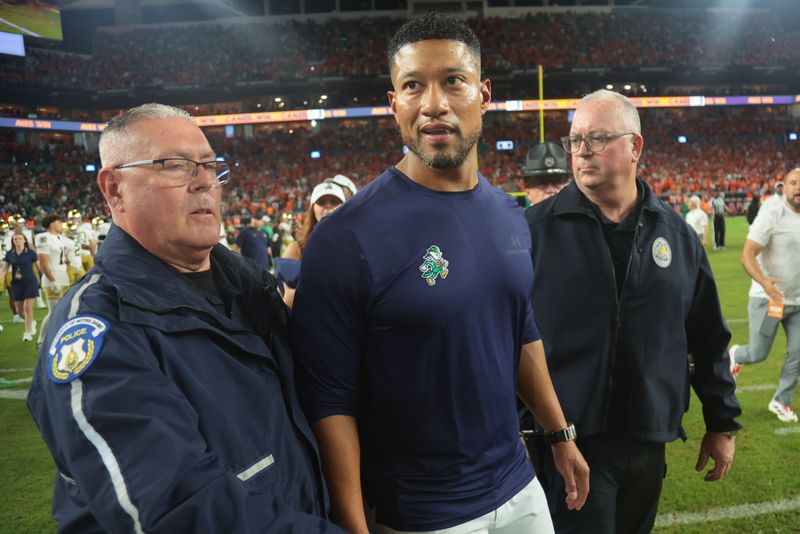 Aug 31, 2025; Miami Gardens, Florida, USA; Notre Dame Fighting Irish head coach Marcus Freeman reacts after the after the game against the Miami Hurricanes at Hard Rock Stadium. Mandatory Credit: Sam Navarro-Imagn Images