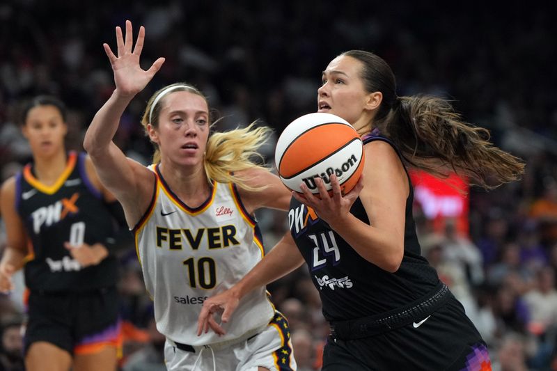 Sep 2, 2025; Phoenix, Arizona, USA; Phoenix Mercury forward Kathryn Westbeld (24) drives past Indiana Fever guard Lexie Hull (10) in the first half at PHX Arena. Mandatory Credit: Rick Scuteri-Imagn Images