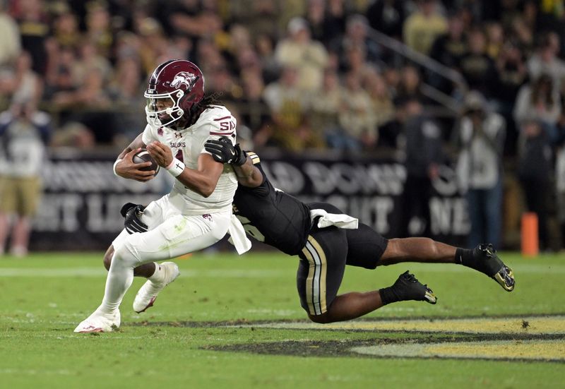 Southern Illinois quarterback DJ Williams is tackled by Purdue linebacker Mani Powell during the second quarter Saturday, Sept. 6, 2025, at Ross-Ade Stadium.