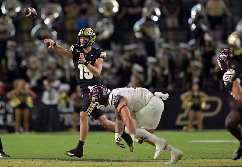 Purdue quarterback Ryan Browne throws a pass over Southern Illinois linebacker Chris Presto during the second half Saturday, Sept. 6, 2025 at Ross-Ade Stadium.