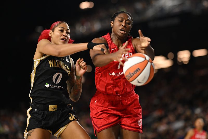Sep 7, 2025; Baltimore, MD, USA; Indiana Fever forward Aliyah Boston (7) and Washington Mystics forward Shakira Austin (0) battle for a rebound during the second quarter at CFG Bank Arena. Mandatory Credit: Rafael Suanes-Imagn Images