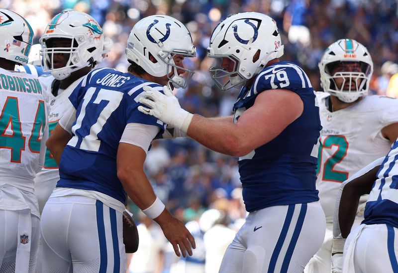 Sep 7, 2025; Indianapolis, Indiana, USA; Indianapolis Colts quarterback Daniel Jones (17) celebrates with offensive tackle Bernhard Raimann (79) after a touchdown during the first half at Lucas Oil Stadium. Mandatory Credit: Trevor Ruszkowski-Imagn Images
