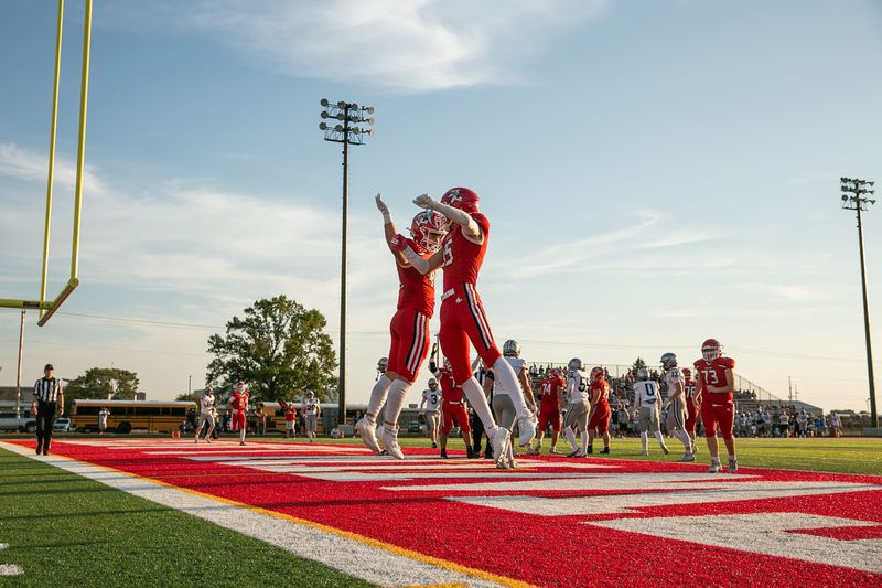 Twin Lakes players Carson Wagner (44) and Ethan Need (15) after Wagner's touchdown run on September 12, 2025.