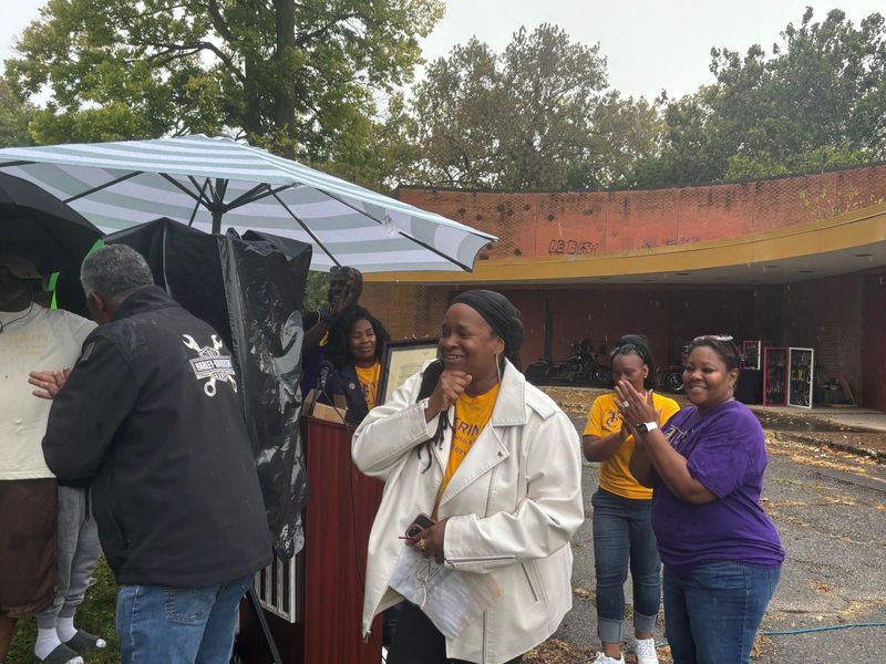 Trinity Center pastor Kim McCrackin smiles after receiving the deed to the former St. Peter Claver Center at 3110 Sutherland Ave. on Sept. 13, 2025.