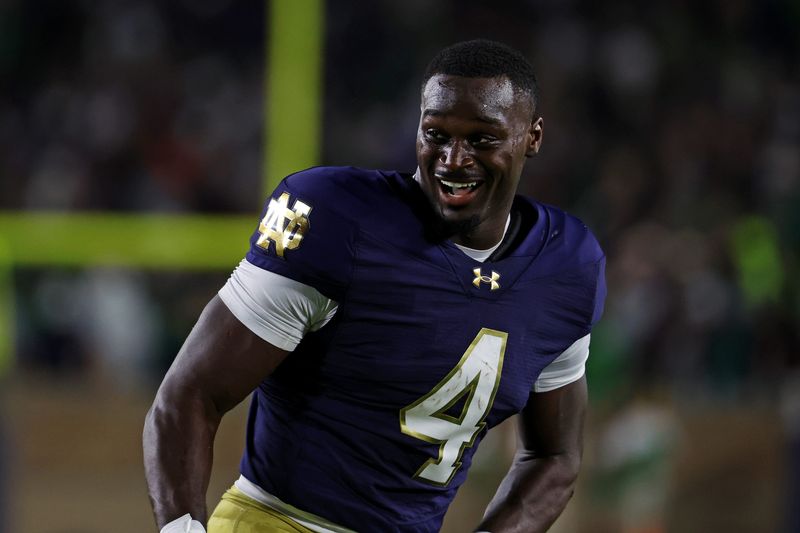 Sep 13, 2025; South Bend, Indiana, USA; Notre Dame Fighting Irish running back Jeremiyah Love (4) reacts after a play during the first half against the Texas A&M Aggies at Notre Dame Stadium. Mandatory Credit: Trevor Ruszkowski-Imagn Images