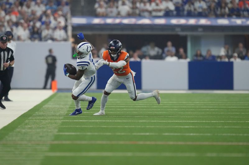 Indianapolis Colts wide receiver Josh Downs (1) is chases out of bounds by Denver Broncos safety Brandon Jones (22) on Sunday, Sept. 14, 2025, during a game at Lucas Oil Stadium in Indianapolis.