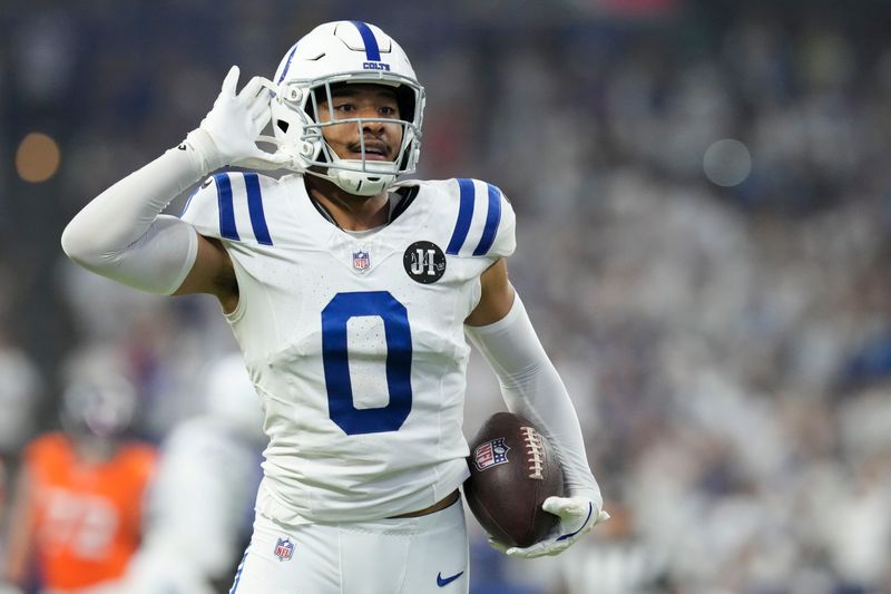 Indianapolis Colts safety Cam Bynum (0) celebrates after making an interception Sunday, Sept. 14, 2025, during a game against the Denver Broncos at Lucas Oil Stadium in Indianapolis.