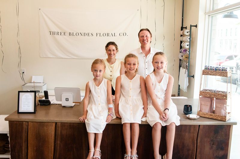 Kelsey Webber, top left, owner of Three Blondes Floral Co., poses with her family: husband Michael, and Collins, Ainsley and Caroline.