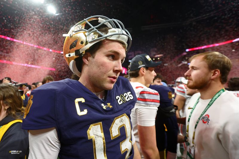 Jan 20, 2025; Atlanta, GA, USA; Notre Dame Fighting Irish quarterback Riley Leonard (13) reacts after losing the CFP National Championship college football game at Mercedes-Benz Stadium. Mandatory Credit: Mark J. Rebilas-Imagn Images