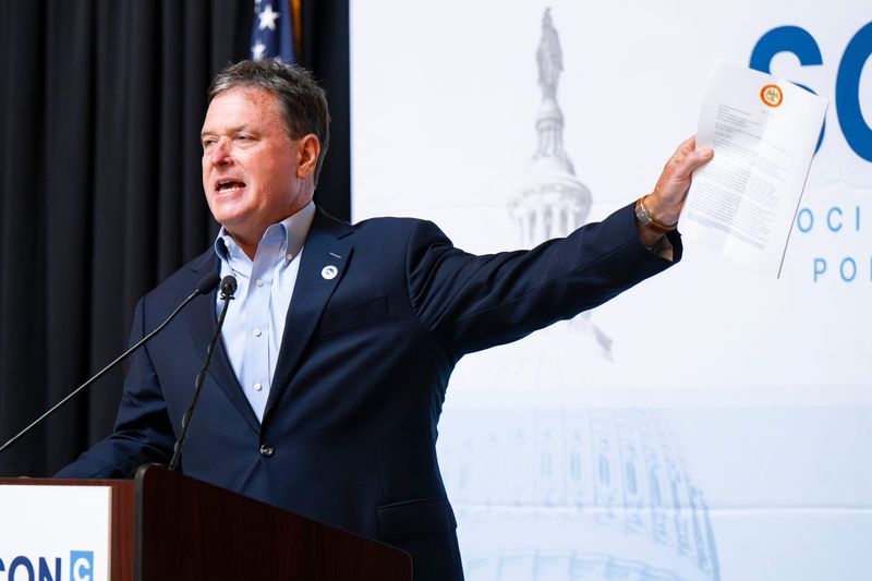 Indiana Attorney General Todd Rokita holds a letter sent to the NCAA urging a ban on transgender women in women’s sports while addressing attendees of 2025 SoConCon, a Social Conservative Policy conference, gathered for a reception Tuesday, July 22, 2025, at the Indiana State House.
