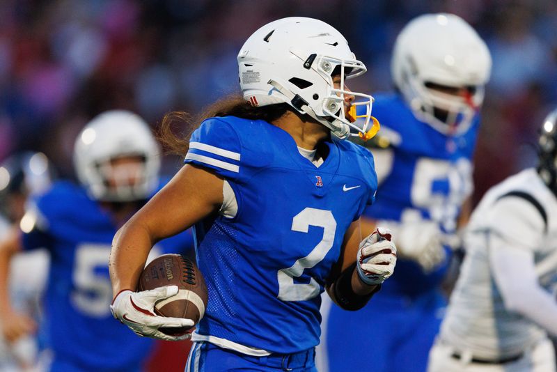 Adams' Carson Bryce (2) runs with the ball during an IHSAA football game between Adams and Saint Joseph at School Field on Friday, Sept. 19, 2025, in South Bend.